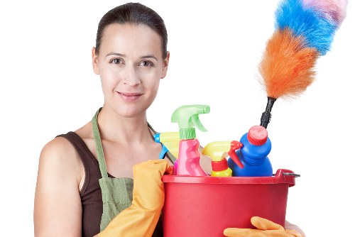 Supervisor reviewing a cleaning checklist with safety measures