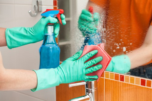 Trained cleaner using approved methods during a Nottinghill cleaning task