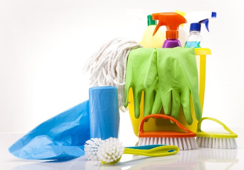 Professional cleaners working in a Notting Hill kitchen during move-out cleaning